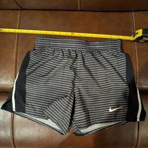 Nike Striped Black and White Shorts Size XL (Girls) Dri-Fit. Has a small pocket